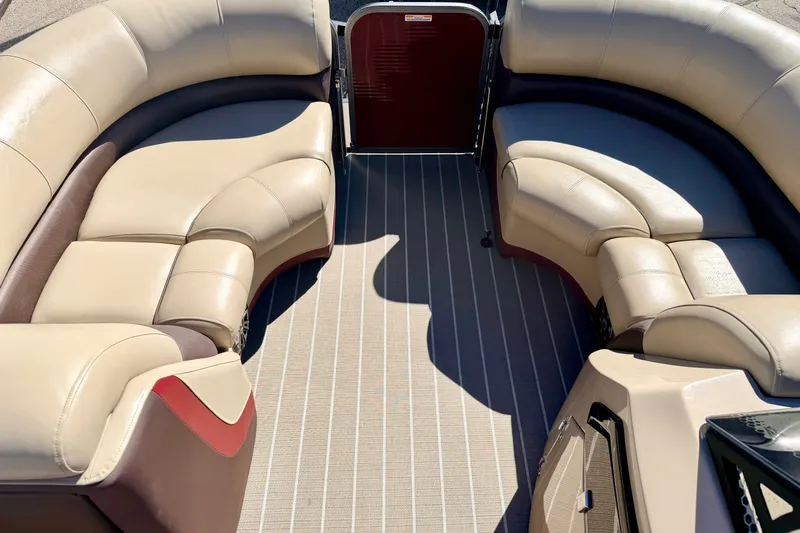 Slide: The Image of Luxurious seating on 2021 Manitou 23 Oasis pontoon boat with beige upholstery. - 76