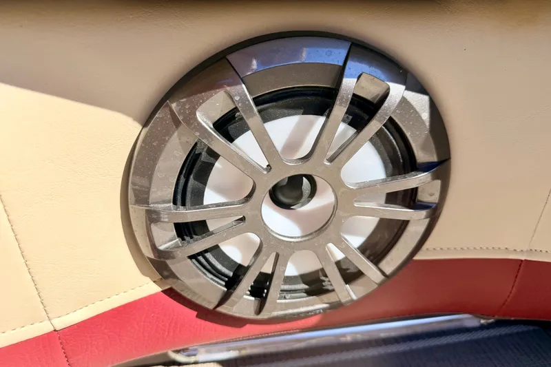 Slide: The Image of Speaker on 2021 Manitou 23 Oasis boat, beige and red interior. - 82