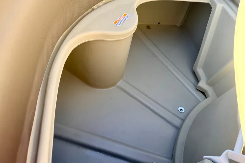 Slide: The Image of Interior storage compartment of a 2021 Manitou 23 Oasis boat. - 68