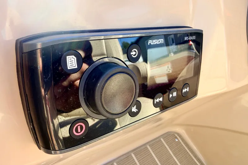 Slide: The Image of Fusion MS-RA55 stereo system on 2021 Manitou 23 Oasis boat dashboard. - 50
