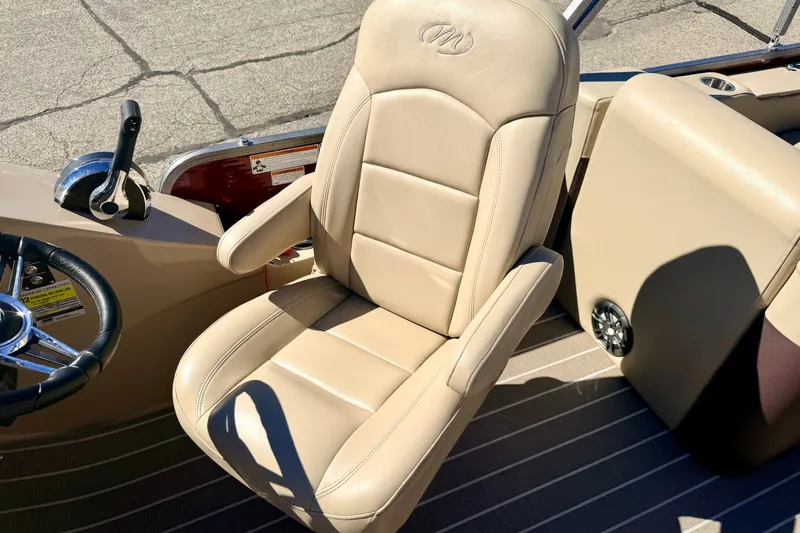 Slide: The Image of Beige captain's chair in 2021 Manitou 23 Oasis boat cockpit. - 45