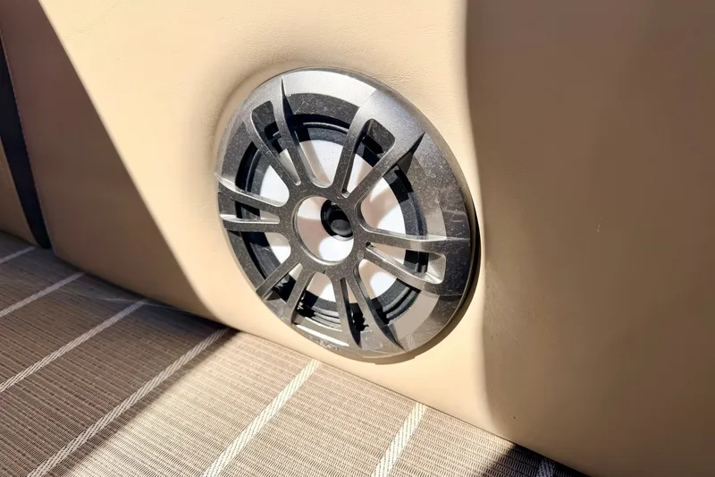 Slide: The Image of Speaker on 2021 Manitou 23 Oasis boat, mounted on beige interior panel. - 83