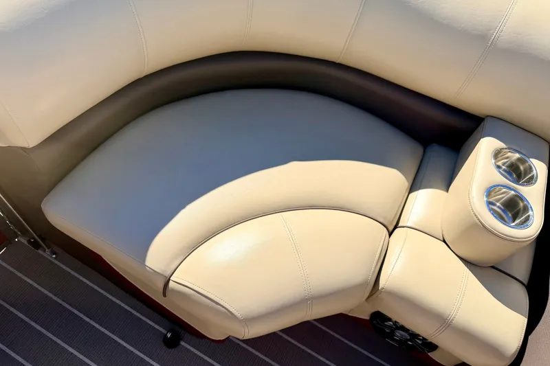 Slide: The Image of Beige leather seating with cup holders on 2021 Manitou 23 Oasis boat. - 67
