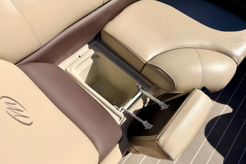 Slide: The Image of 2021 Manitou 23 Oasis boat seat with open storage compartment, beige upholstery. - 75