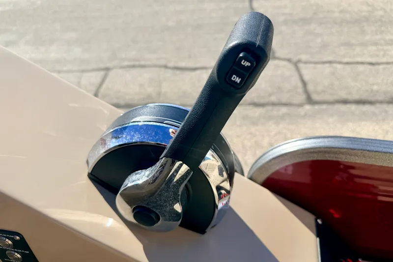 Slide: The Image of Throttle control lever on a 2021 Manitou 23 Oasis boat. - 53
