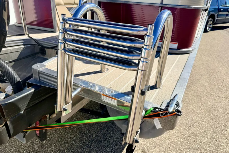 Slide: The Image of 2021 Manitou 23 Oasis boat with stainless steel ladder on deck. - 27