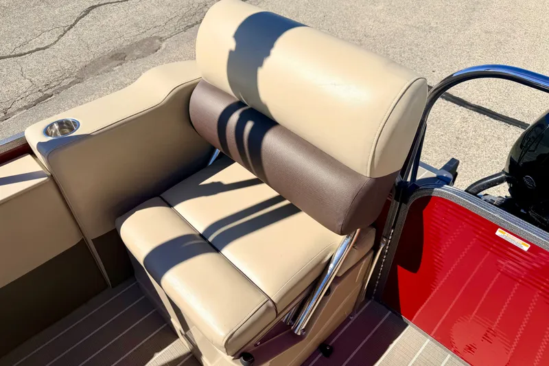 Slide: The Image of Beige and brown seating on 2021 Manitou 23 Oasis boat with cup holder. - 32
