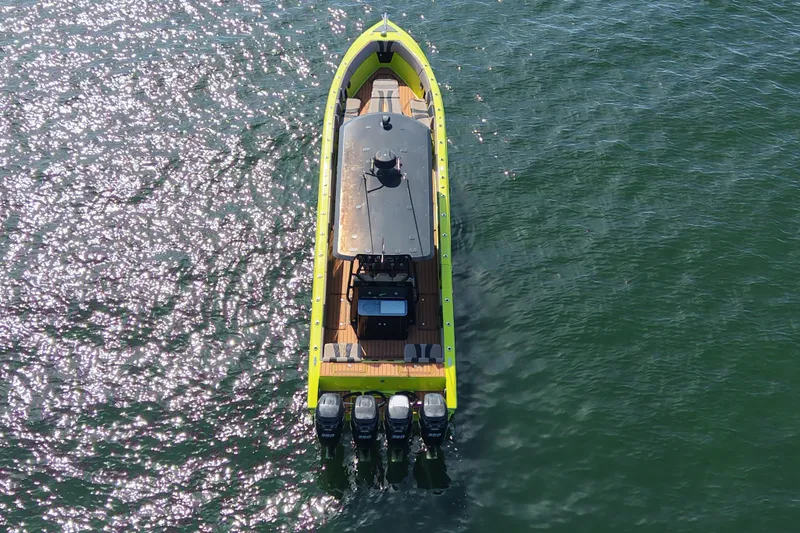Slide: The Image of Aerial view of 2016 Midnight Express 43 Open boat on shimmering water. - 3