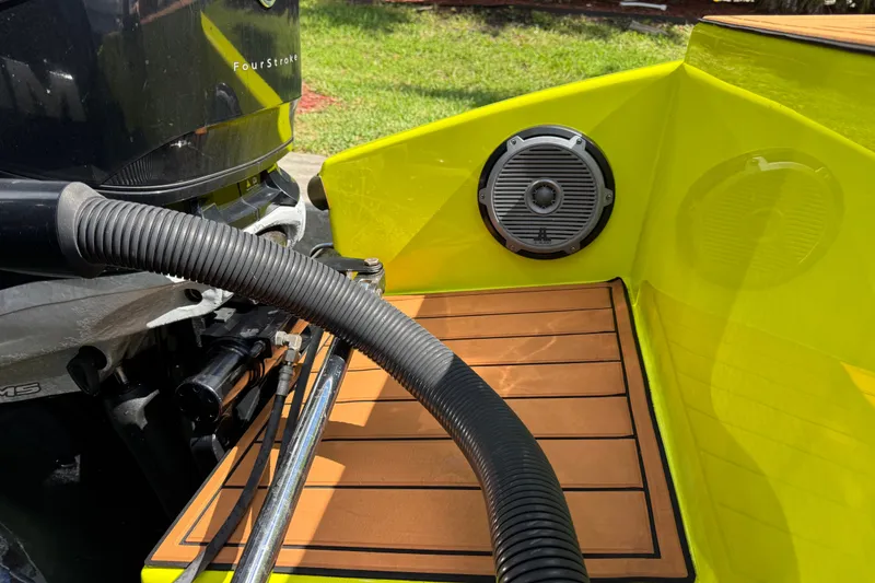 Slide: The Image of Yellow Midnight Express 43 Open boat, 2016 model, featuring a four-stroke engine and deck speaker. - 21