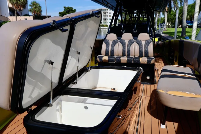 Slide: The Image of 2016 Midnight Express 43 Open boat interior with seating and storage compartments. - 7