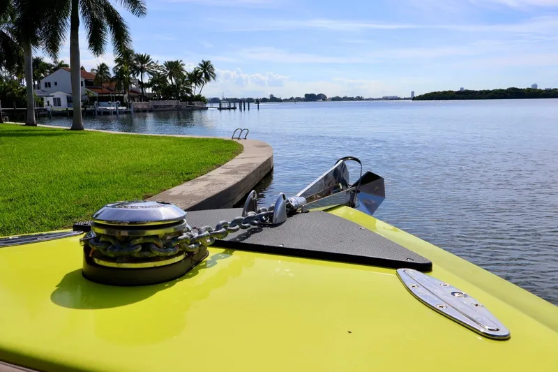 Slide: The Image of Bow of 2016 Midnight Express 43 Open boat with scenic waterfront view. - 12