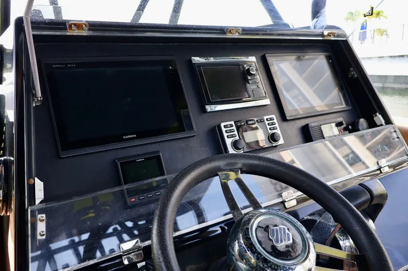 Slide: The Image of Control panel of a 2016 Midnight Express 43 Open boat with navigation equipment. - 14