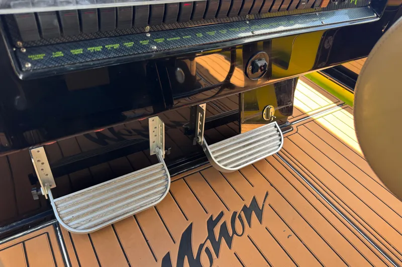 Slide: The Image of Control panel and footrests on a 2016 Midnight Express 43 Open boat. - 16