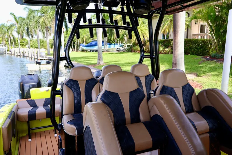 Slide: The Image of Interior of 2016 Midnight Express 43 Open boat with luxurious seating and scenic waterfront view. - 15