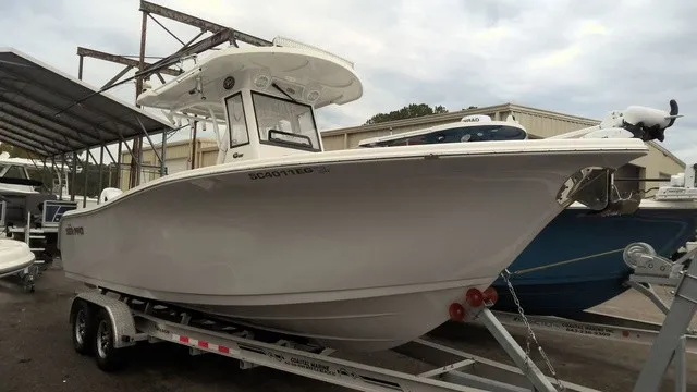 The Image of A 2024 Sea Pro 262 Center Console boat on a trailer, ready for the water. - 0