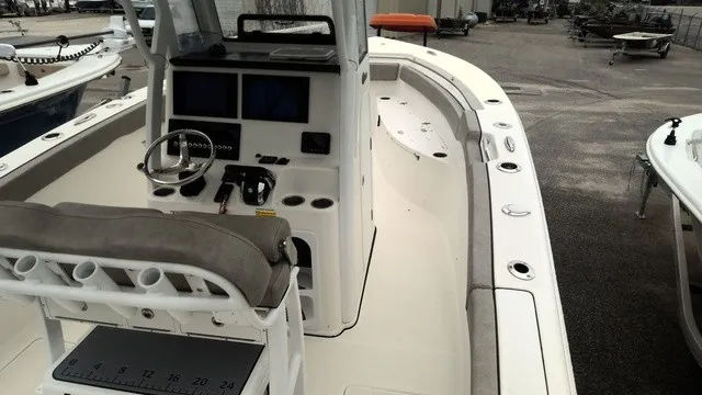 Slide: The Image of The image shows a 2024 Sea Pro 262 Center Console boat with a modern helm and spacious deck. - 3