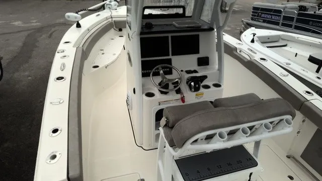 Slide: The Image of The image shows a 2024 Sea Pro 262 Center Console boat with a spacious helm area. - 4