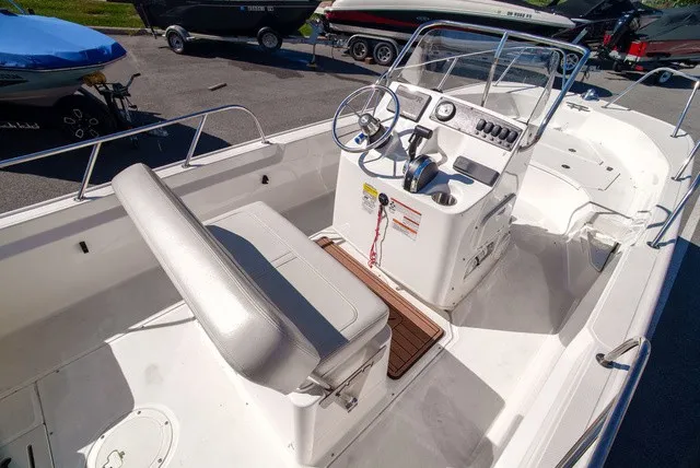 Slide: The Image of The image shows the cockpit of a 2022 Boston Whaler 170 Montauk with a helm and bench seat. - 9