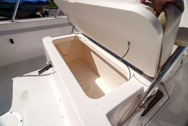 Slide: The Image of An open storage compartment on a 2022 Boston Whaler 170 Montauk boat. - 11
