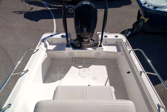 Slide: The Image of The image shows the cockpit of a 2022 Boston Whaler 170 Montauk with an outboard motor. - 7