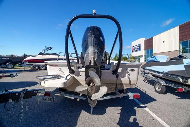 Slide: The Image of A 2022 Boston Whaler 170 Montauk on a trailer. The outboard motor is visible. - 2