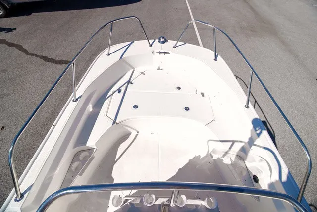 Slide: The Image of The image shows the deck of a 2022 Boston Whaler 170 Montauk with stainless steel railings. - 20