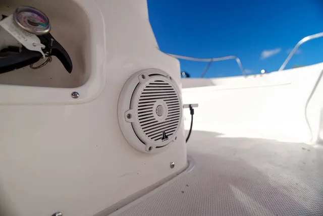 Slide: The Image of Close-up of a speaker on a white boat with a blue sky in the background. - 16