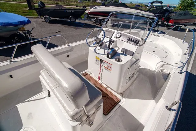 Slide: The Image of The image shows a 2022 Boston Whaler 170 Montauk with an open cockpit and helm console. - 10