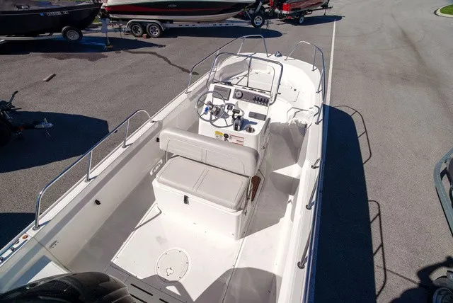 Slide: The Image of The image shows a 2022 Boston Whaler 170 Montauk boat with an open cockpit and helm console. - 6