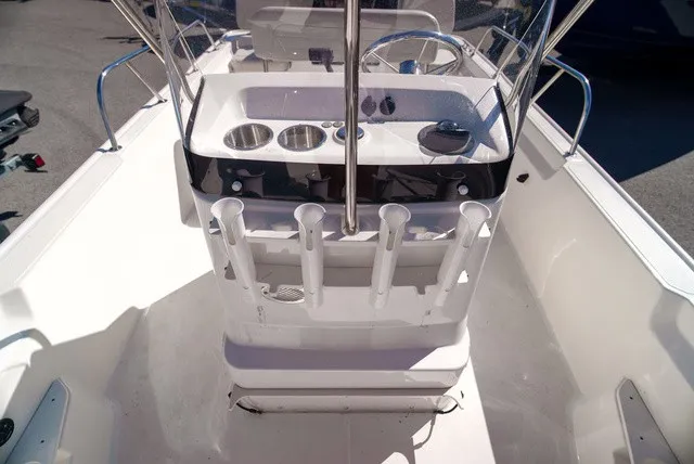 Slide: The Image of The image shows the cockpit of a 2022 Boston Whaler 170 Montauk with fishing rod holders. - 19