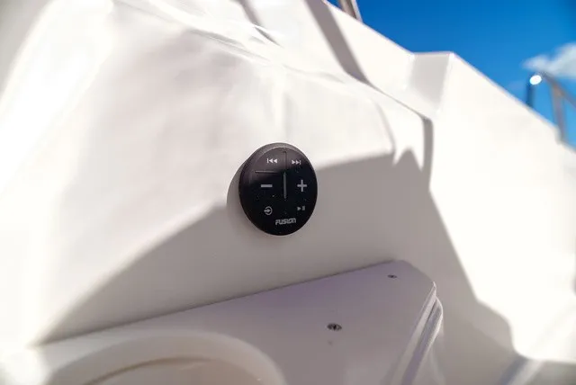 Slide: The Image of Close-up of a Fusion audio controller on a boat. - 17