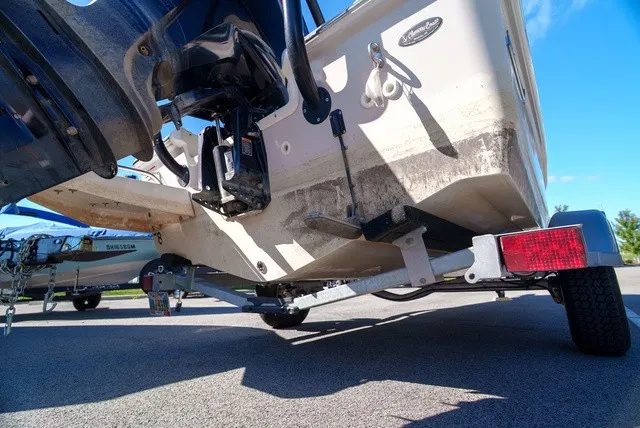 Slide: The Image of The image shows the stern of a 2022 Boston Whaler 170 Montauk on a trailer. - 4