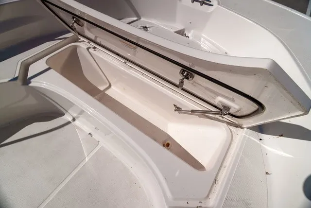 Slide: The Image of An open storage compartment on a 2022 Boston Whaler 170 Montauk boat. - 21