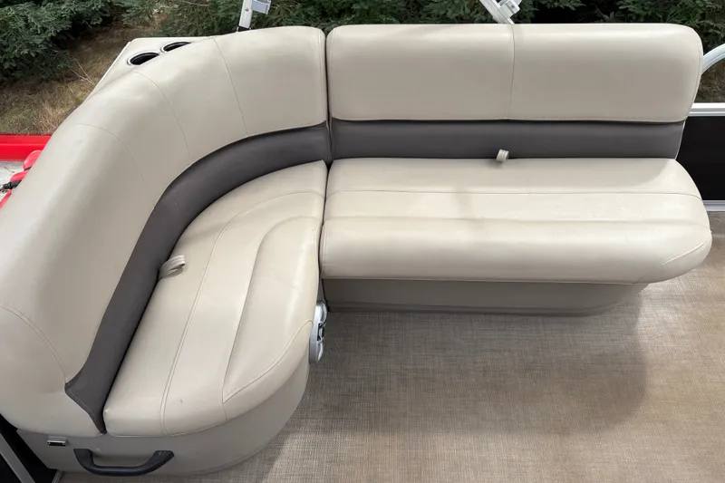 Slide: The Image of 2025 Sun Tracker Party Barge 16 DLX pontoon boat seating, beige and gray upholstery. - 30