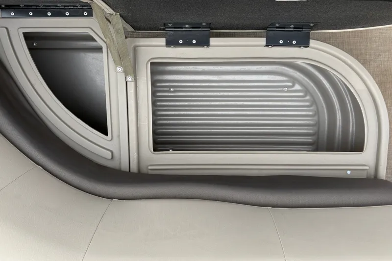 Slide: The Image of Interior view of 2025 Sun Tracker Party Barge 16 DLX, showcasing seating and storage area. - 25