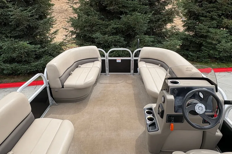 Slide: The Image of 2025 Sun Tracker Party Barge 16 DLX pontoon boat with spacious seating and modern helm. - 13