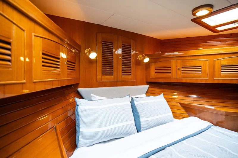 Slide: The Image of Luxurious cabin interior of 2009 Marlow 61C yacht with polished wood finish. - 100