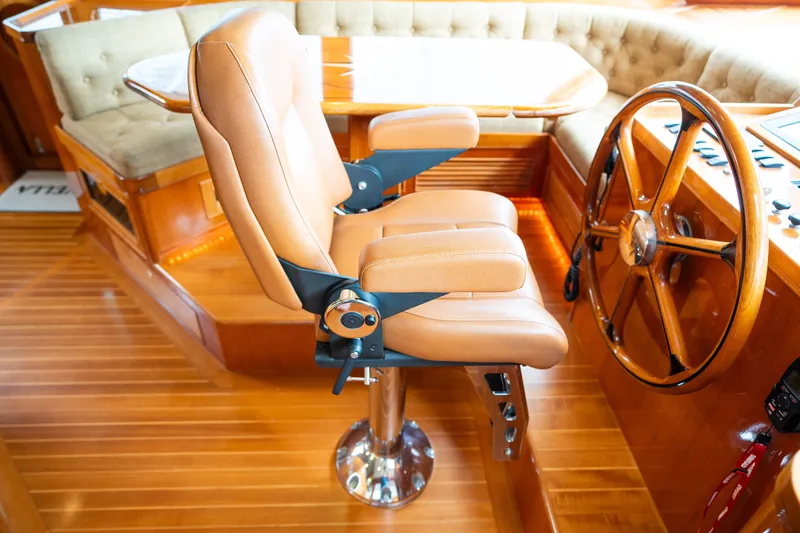 Slide: The Image of Luxurious helm seat and steering wheel on 2009 Marlow 61C yacht interior. - 51