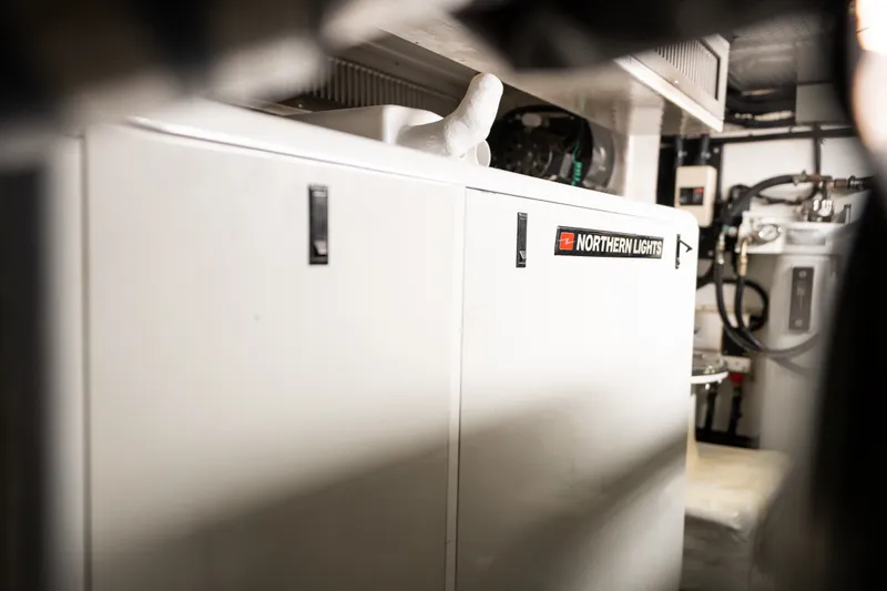 Slide: The Image of Engine room of 2009 Marlow 61C yacht featuring Northern Lights generator. - 135