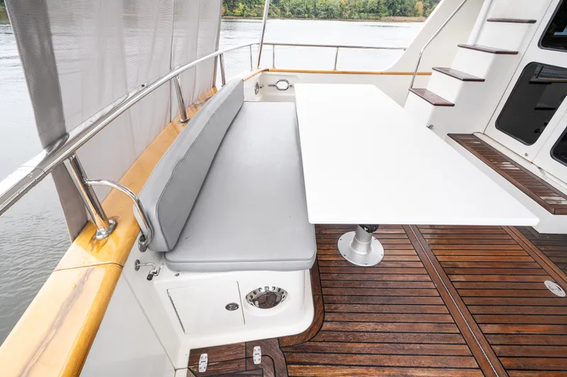 Slide: The Image of Luxury Marlow 61C yacht deck with seating and table, 2009 model. - 13