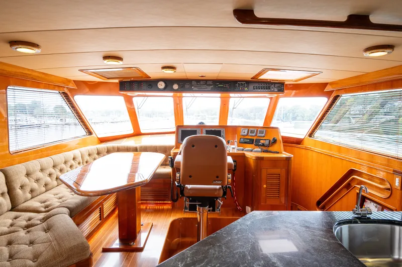 Slide: The Image of Luxurious interior of 2009 Marlow 61C yacht with plush seating and modern helm. - 62