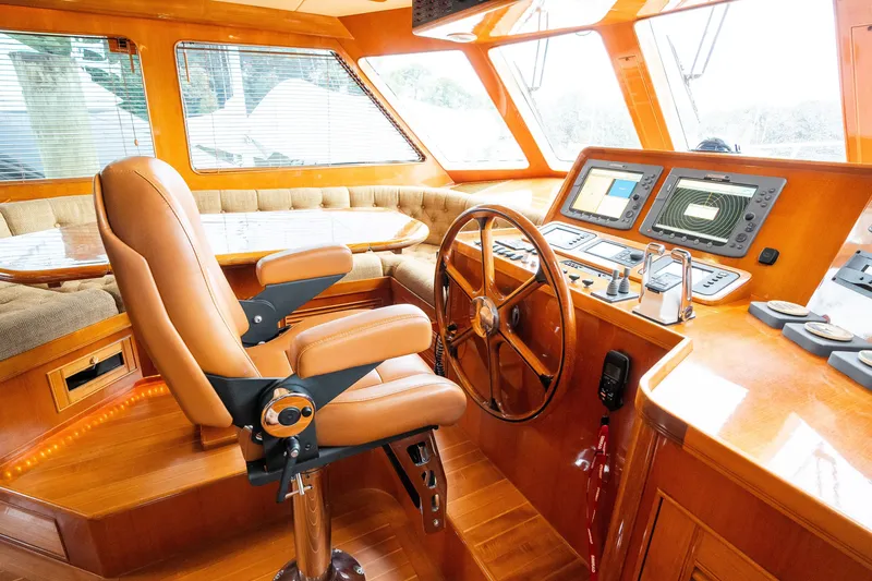 Slide: The Image of Luxurious 2009 Marlow 61C yacht helm with leather captain's chair and advanced navigation systems. - 45