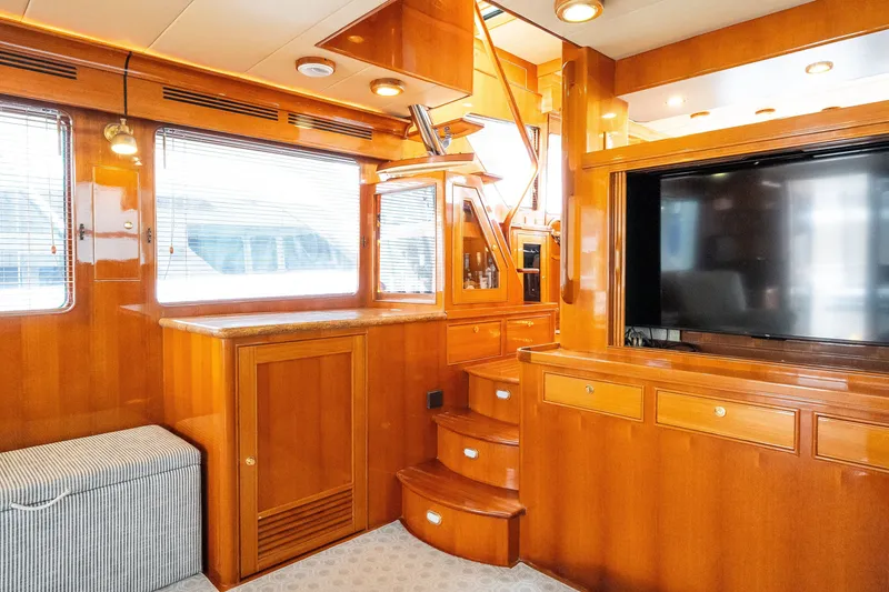 Slide: The Image of Luxurious interior of 2009 Marlow 61C yacht with wooden cabinetry and large TV. - 34