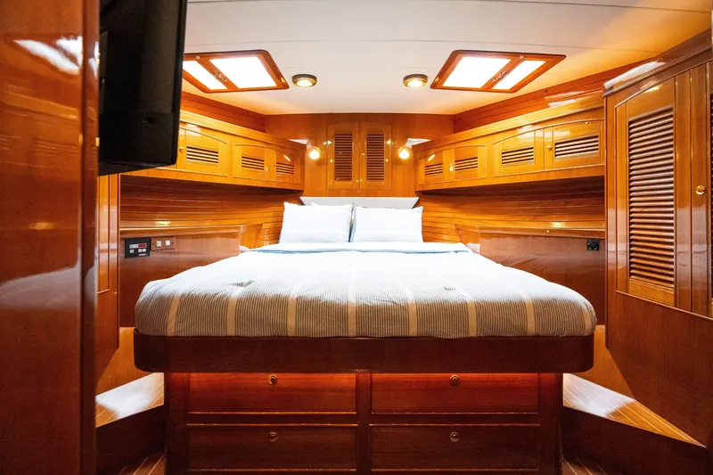 Slide: The Image of Luxurious cabin interior of 2009 Marlow 61C yacht with polished wood finish. - 97