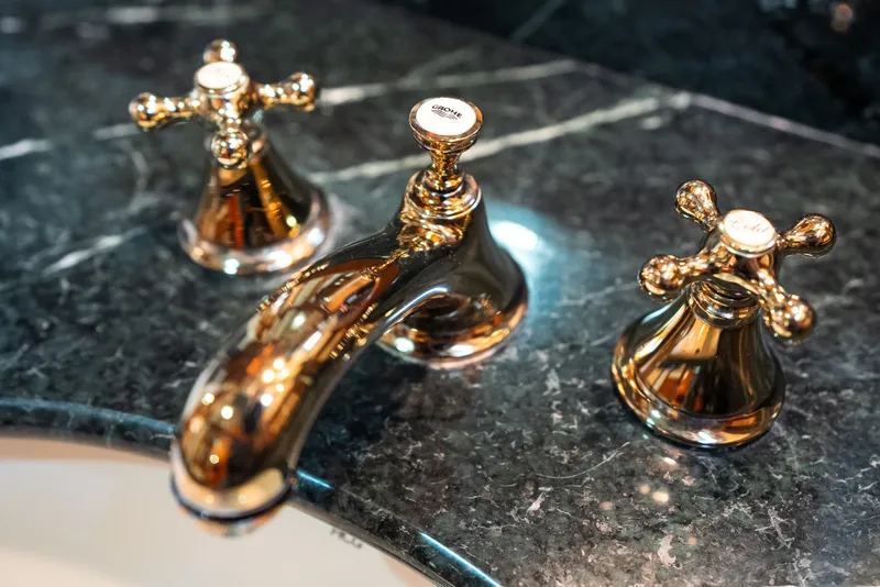 Slide: The Image of Luxurious gold bathroom faucet set on elegant marble countertop, Marlow 61C model, 2009. - 118