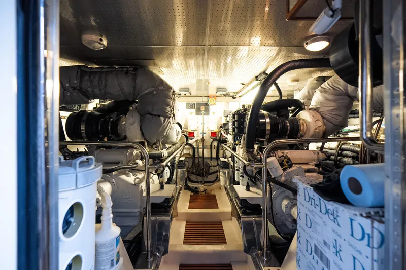 Slide: The Image of Engine room of a 2009 Marlow 61C yacht, showcasing machinery and equipment. - 130