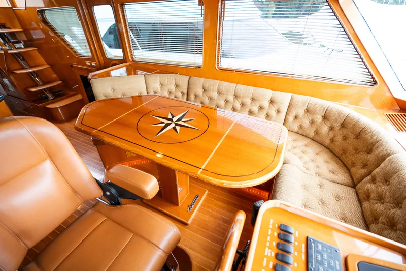 Slide: The Image of Luxurious interior of 2009 Marlow 61C yacht with elegant wood finishes and plush seating. - 54