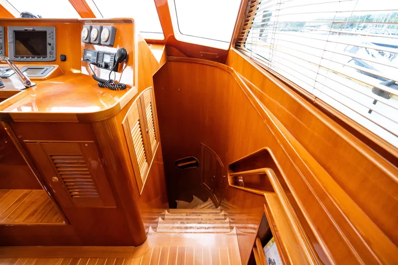 Slide: The Image of Luxurious wooden interior of a 2009 Marlow 61C yacht with navigation equipment. - 84