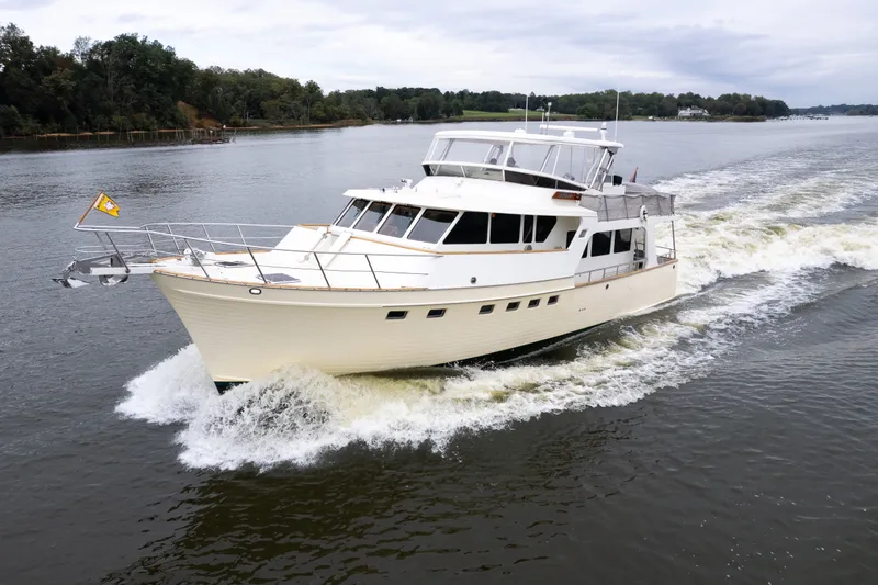 Slide: The Image of Luxury 2009 Marlow 61C yacht cruising on a serene river. - 7