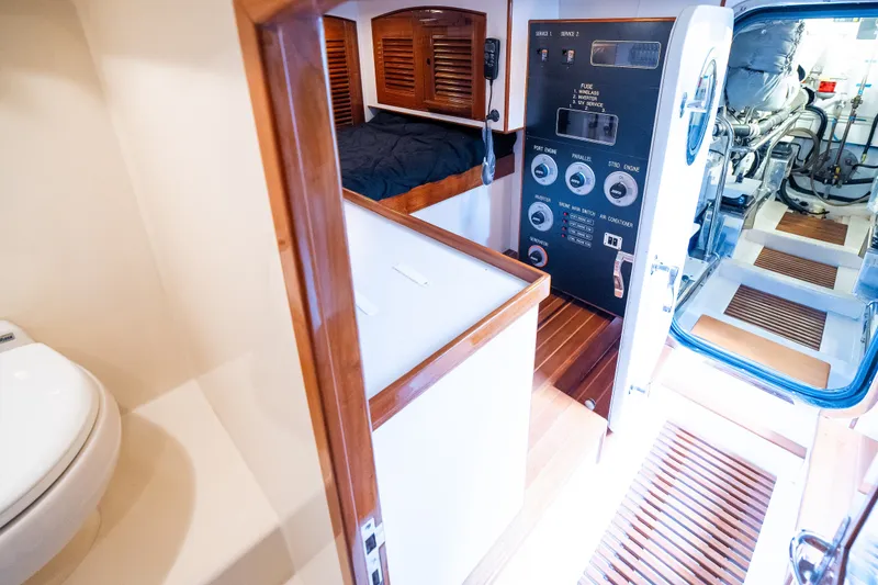Slide: The Image of Interior of 2009 Marlow 61C yacht showing cabin, control panel, and engine room. - 129
